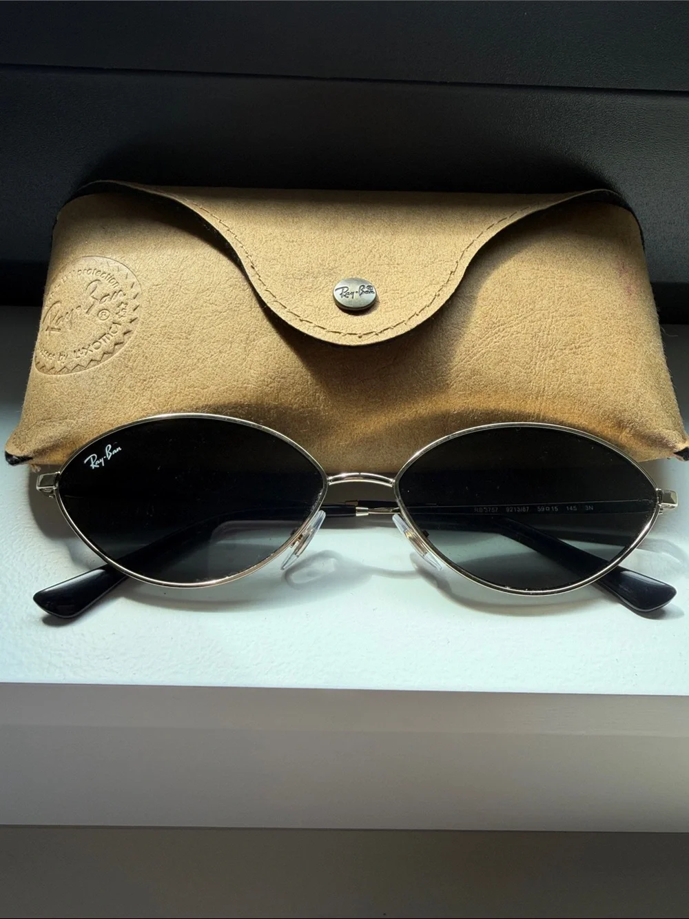 Ray-Ban Oval Metal Sunglasses in Black and Gold Frames